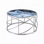 Table basse ronde piètement ouvert chromé, marbre synthétique bleu
