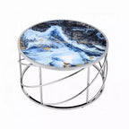 Table basse ronde piètement ouvert chromé, marbre synthétique bleu